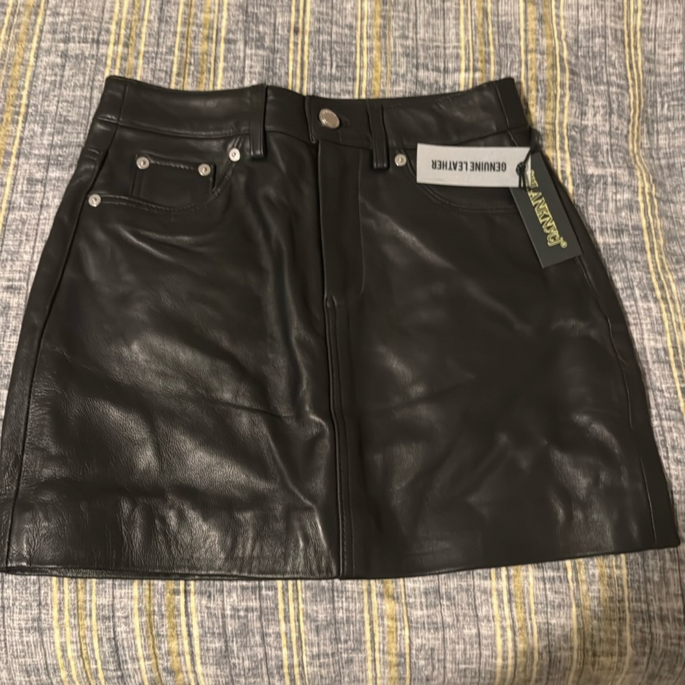 “LEATHER MINI SKIRT”
